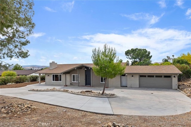 27130 Blue Hill Dr, Menifee, CA 92586 - ranch-style house featuring driveway, an attached garage, stucco siding, and a chimney