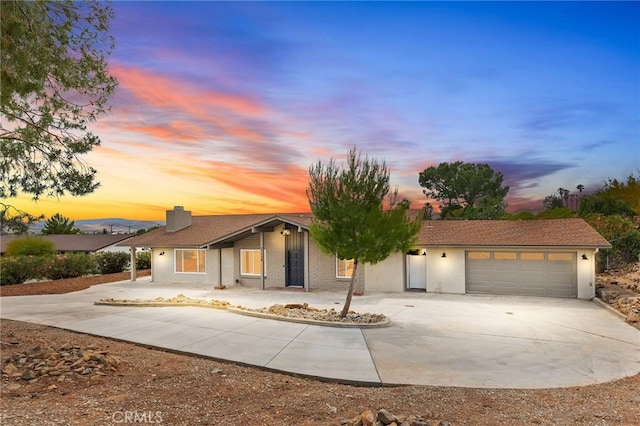 27130 Blue Hill Dr, Menifee, CA 92586 - ranch-style home with driveway, a garage, stucco siding, and a chimney