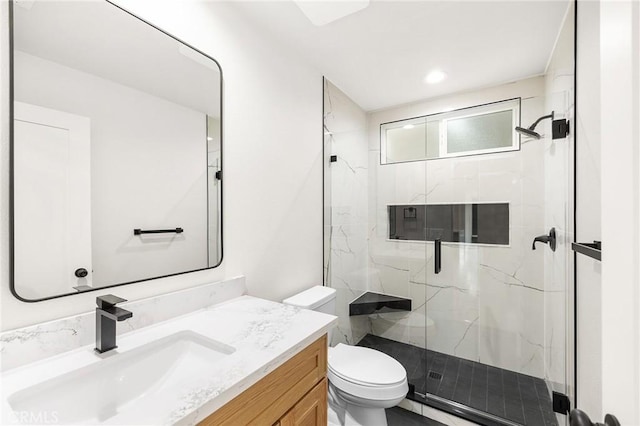 27130 Blue Hill Dr, Menifee, CA 92586 - bathroom featuring a marble finish shower, vanity, toilet, and recessed lighting