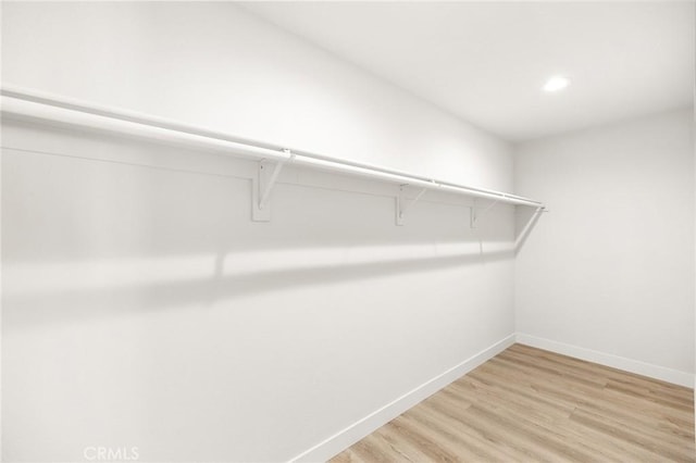 27130 Blue Hill Dr, Menifee, CA 92586 - walk in closet with light wood-style floors