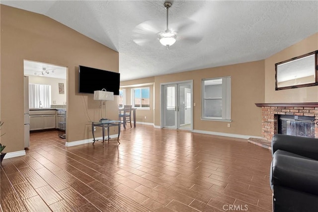 11941 9th Ave, Hesperia, CA 92345 - living area featuring ceiling fan, wood finished floors, baseboards, and a textured ceiling