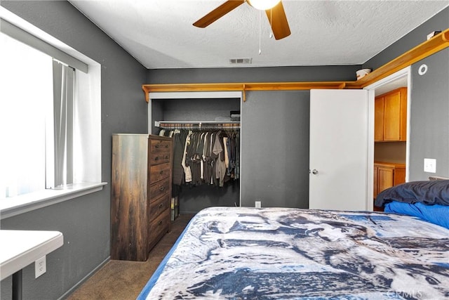 11941 9th Ave, Hesperia, CA 92345 - bedroom featuring carpet flooring, a closet, a ceiling fan, and a textured ceiling