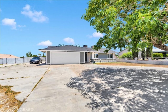 11941 9th Ave, Hesperia, CA 92345 - ranch-style home with concrete driveway, a garage, and stucco siding