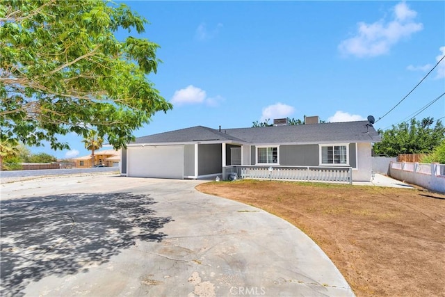 11941 9th Ave, Hesperia, CA 92345 - ranch-style house featuring concrete driveway, a garage, stucco siding, and a porch