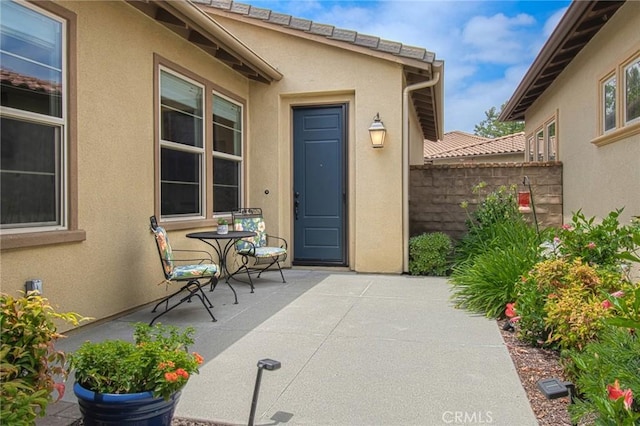 67 Galan St, Rancho Mission Viejo, CA 92694 - view of exterior entry featuring stucco siding and a patio area