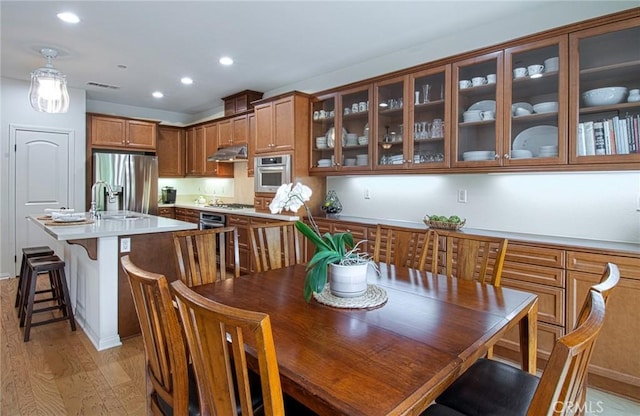 67 Galan St, Rancho Mission Viejo, CA 92694 - dining room with light wood finished floors and recessed lighting