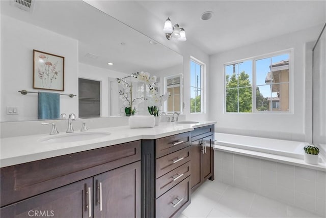 719 Huron Pl, Claremont, CA 91711 - full bath with double vanity, tile patterned floors, a bath, and a shower