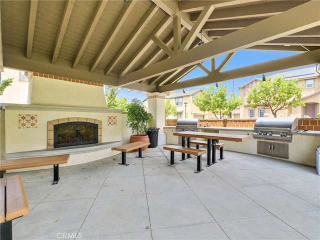 719 Huron Pl, Claremont, CA 91711 - view of patio / terrace with a tiled fireplace and area for grilling