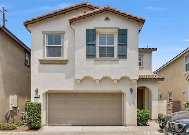 719 Huron Pl, Claremont, CA 91711 - mediterranean / spanish house with a tile roof, stucco siding, and an attached garage