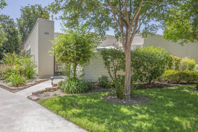 2092 Ronda Granada Unit C, Laguna Woods, CA 92637 - view of front of house featuring a front yard and stucco siding