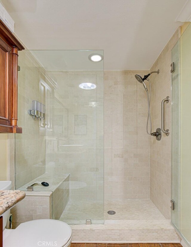 2092 Ronda Granada Unit C, Laguna Woods, CA 92637 - bathroom featuring toilet, a stall shower, and vanity