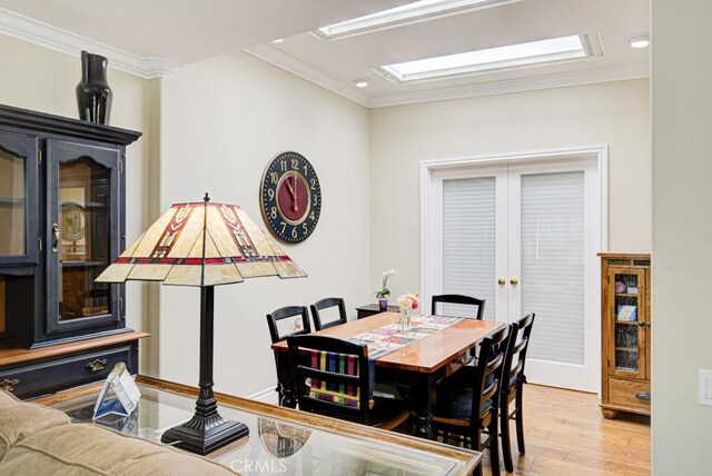 2092 Ronda Granada Unit C, Laguna Woods, CA 92637 - dining room featuring wood finished floors, ornamental molding, and recessed lighting