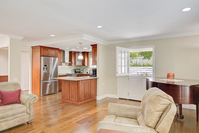 2092 Ronda Granada Unit C, Laguna Woods, CA 92637 - living area with light wood-type flooring, recessed lighting, ornamental molding, ornate columns, and baseboards
