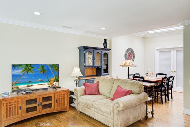 2092 Ronda Granada Unit C, Laguna Woods, CA 92637 - living area featuring crown molding, wood finished floors, recessed lighting, and baseboards