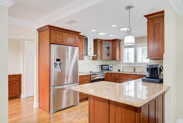 2092 Ronda Granada Unit C, Laguna Woods, CA 92637 - kitchen with appliances with stainless steel finishes, wall chimney exhaust hood, a peninsula, a sink, and light wood finished floors
