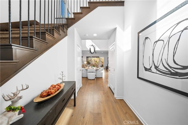 105 Newall, Irvine, CA 92618 - corridor with stairs, wood finished floors, and baseboards