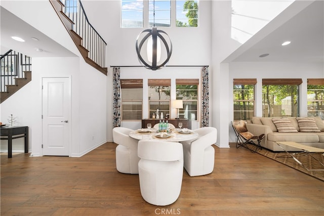 105 Newall, Irvine, CA 92618 - dining room featuring a high ceiling, stairs, wood finished floors, baseboards, and recessed lighting