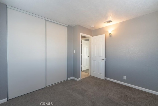 11314 Mariposa Rd, Hesperia, CA 92345 - unfurnished bedroom featuring carpet floors, baseboards, and a closet