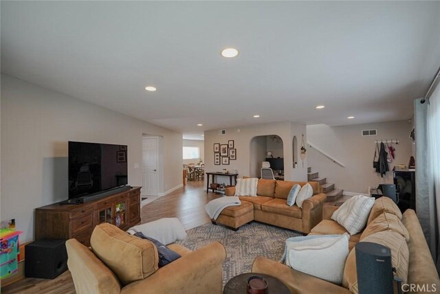 318 S Lucia Ave, Redondo Beach, CA 90277 - living area with stairway, arched walkways, light wood-type flooring, and recessed lighting