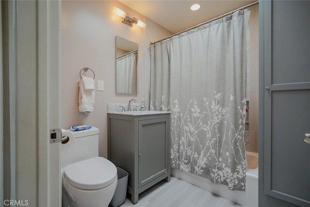 318 S Lucia Ave, Redondo Beach, CA 90277 - bathroom featuring vanity, toilet, shower / bath combo, recessed lighting, and wood finished floors