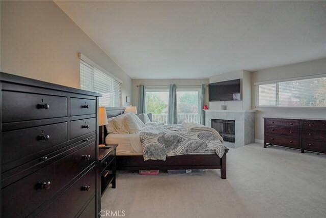 318 S Lucia Ave, Redondo Beach, CA 90277 - bedroom with multiple windows, light colored carpet, a fireplace, and baseboards