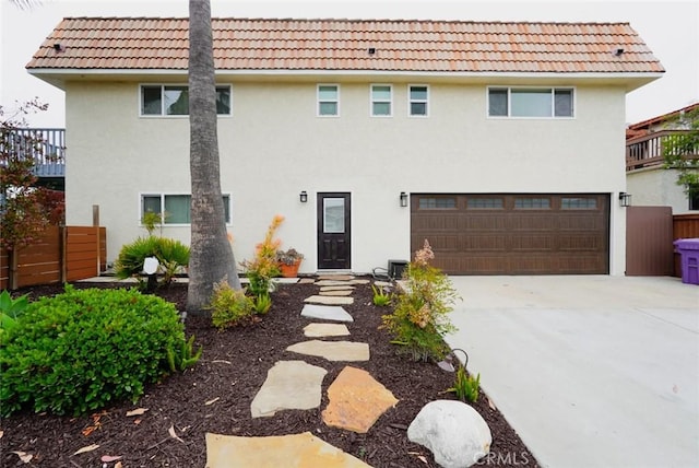 318 S Lucia Ave, Redondo Beach, CA 90277 - view of front of home with a tiled roof, stucco siding, driveway, and an attached garage