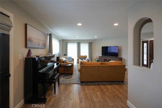 318 S Lucia Ave, Redondo Beach, CA 90277 - living room with wood finished floors, recessed lighting, arched walkways, and baseboards