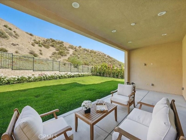 18814 Annmae Pl, Saugus, CA 91350 - fenced backyard with a mountain view, an outdoor living space, and a patio