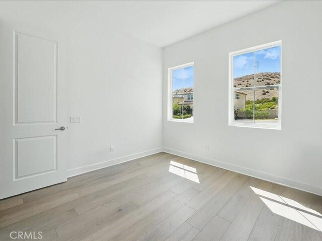 18814 Annmae Pl, Saugus, CA 91350 - spare room featuring light wood-style flooring and baseboards