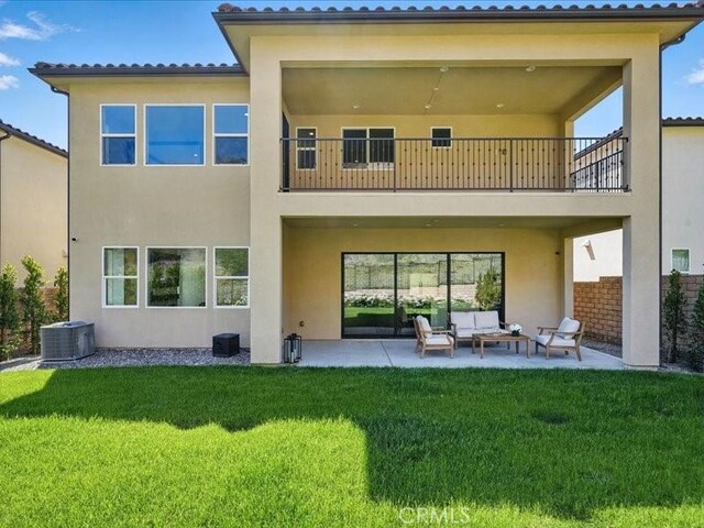 18814 Annmae Pl, Saugus, CA 91350 - back of property featuring an outdoor living space, a patio area, stucco siding, and a balcony