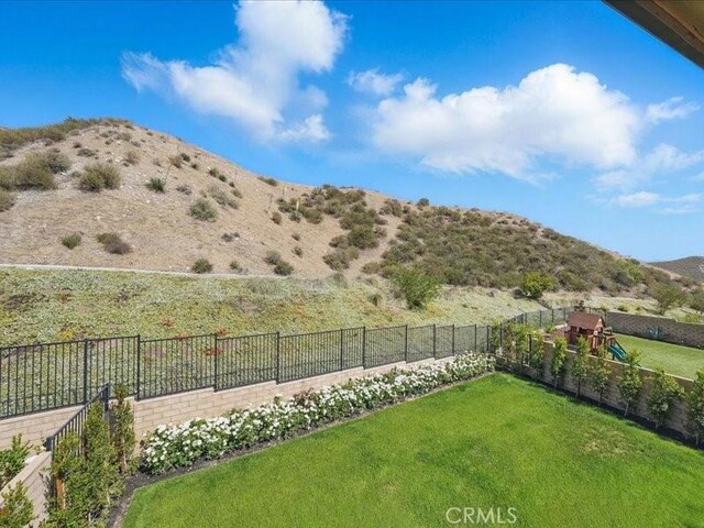 18814 Annmae Pl, Saugus, CA 91350 - fenced backyard with a playground and a mountain view