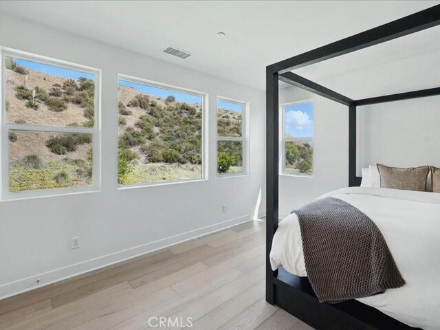 18814 Annmae Pl, Saugus, CA 91350 - bedroom with light wood-style floors and baseboards