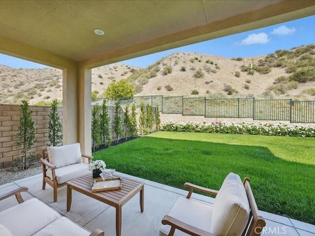 18814 Annmae Pl, Saugus, CA 91350 - fenced backyard with a mountain view, an outdoor living space, and a patio area