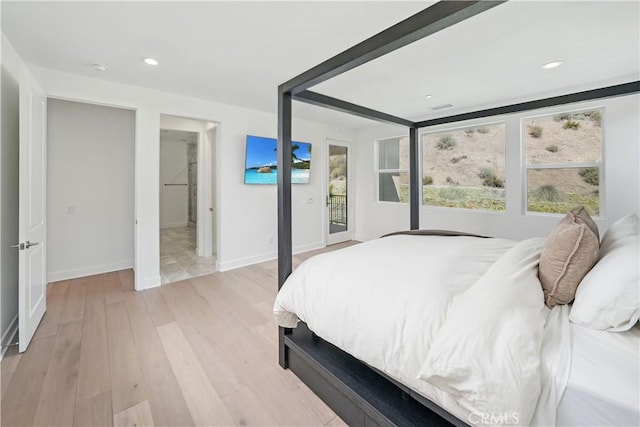 18814 Annmae Pl, Saugus, CA 91350 - bedroom featuring multiple windows, access to exterior, light wood finished floors, and recessed lighting