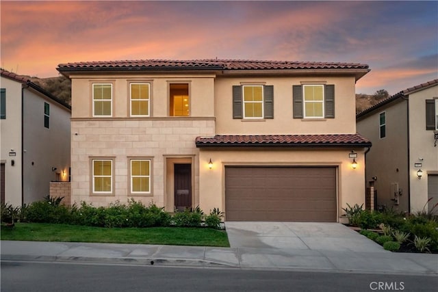 18814 Annmae Pl, Saugus, CA 91350 - mediterranean / spanish house featuring concrete driveway, an attached garage, a tile roof, and stucco siding