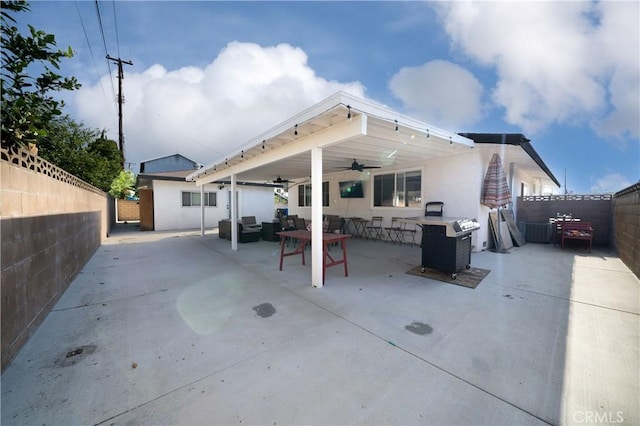 9966 Vernon Ave, Montclair, CA 91763 - rear view of property featuring a ceiling fan, a fenced backyard, a patio, and outdoor lounge area
