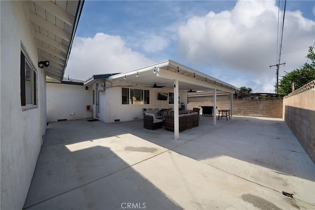 9966 Vernon Ave, Montclair, CA 91763 - back of house with a ceiling fan, outdoor lounge area, a fenced backyard, a patio, and stucco siding