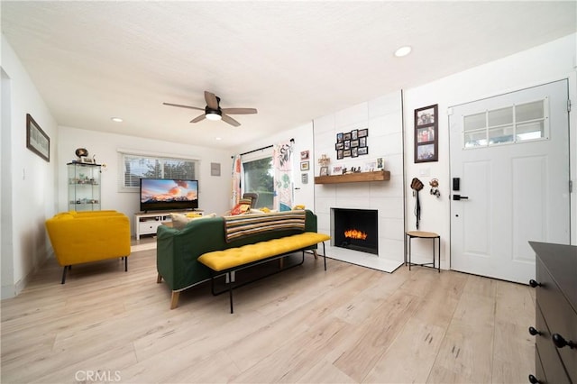 9966 Vernon Ave, Montclair, CA 91763 - living area featuring ceiling fan, light wood-style flooring, a fireplace, and recessed lighting