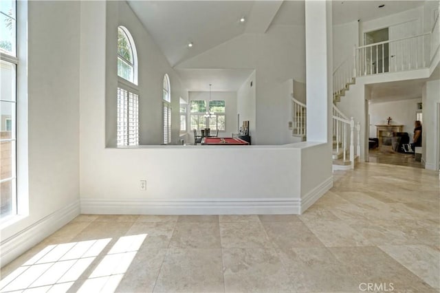 25792 Maple View Dr, Laguna Hills, CA 92653 - foyer featuring high vaulted ceiling, stairs, and baseboards