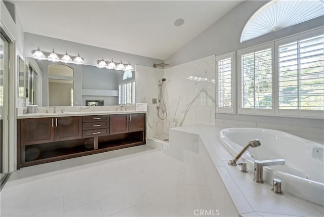25792 Maple View Dr, Laguna Hills, CA 92653 - bathroom with vaulted ceiling, a garden tub, a walk in shower, double vanity, and tile patterned floors