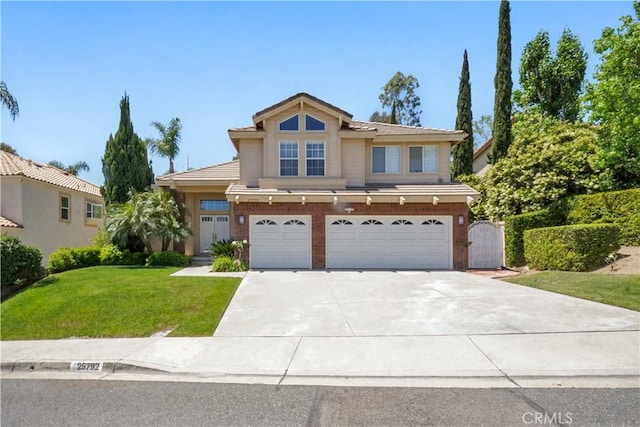 25792 Maple View Dr, Laguna Hills, CA 92653 - traditional home featuring an attached garage, concrete driveway, a front yard, and a tile roof