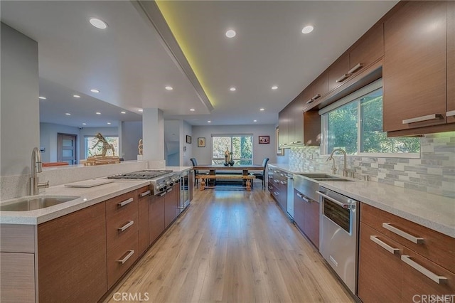 3921 Beverly Glen Blvd, Sherman Oaks, CA 91423 - kitchen with a sink, modern cabinets, appliances with stainless steel finishes, and recessed lighting