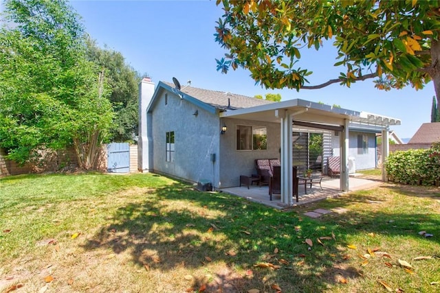 28015 Tupelo Ridge Dr, Valencia, CA 91354 - rear view of house featuring a chimney, a patio, and stucco siding
