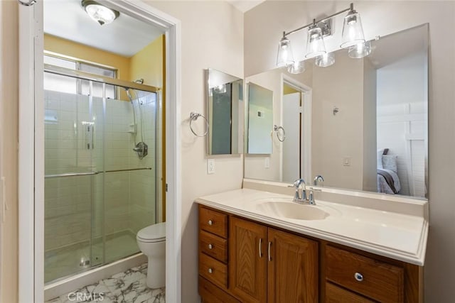 28015 Tupelo Ridge Dr, Valencia, CA 91354 - full bathroom featuring marble finish flooring, vanity, a shower stall, and toilet