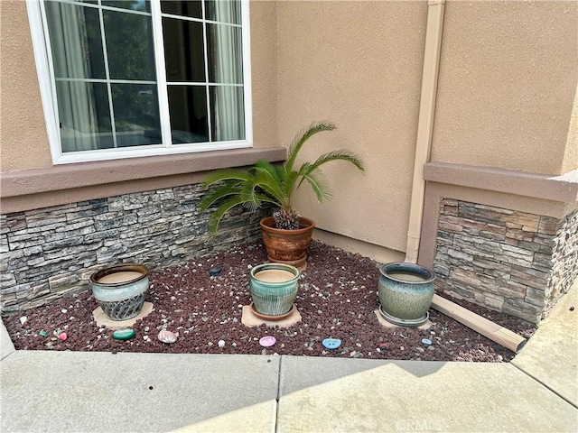 5836 Indian Canyon Dr, Banning, CA 92220 - exterior view of stucco siding and stone siding