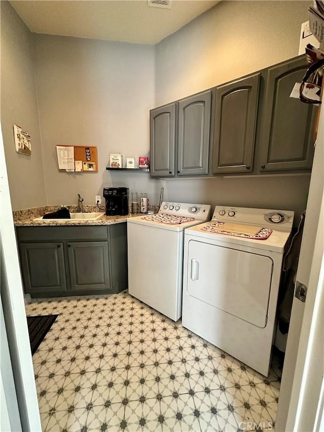 5836 Indian Canyon Dr, Banning, CA 92220 - washroom with cabinet space, washer and dryer, and light flooring