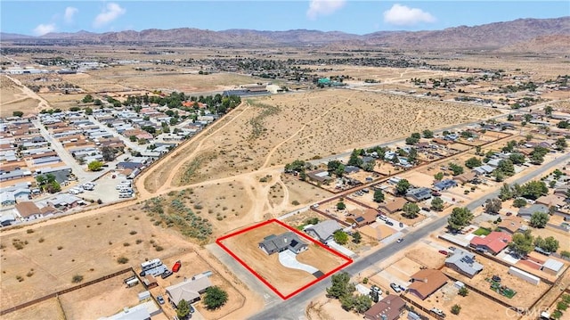22212 Lone Eagle Rd, Apple Valley, CA 92308 - aerial view of property and surrounding area featuring property boundaries highlighted and a mountainous background