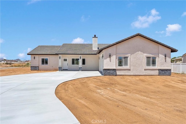 22212 Lone Eagle Rd, Apple Valley, CA 92308 - rear view of property with a chimney, stucco siding, a patio area, and a tiled roof