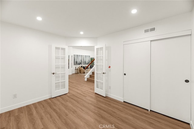 12573 Brickellia St, San Diego, CA 92129 - unfurnished bedroom with french doors, baseboards, wood finished floors, recessed lighting, and a closet