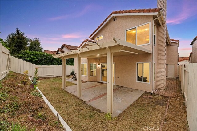 12573 Brickellia St, San Diego, CA 92129 - rear view of house featuring a patio area, stucco siding, a fenced backyard, a tile roof, and a chimney